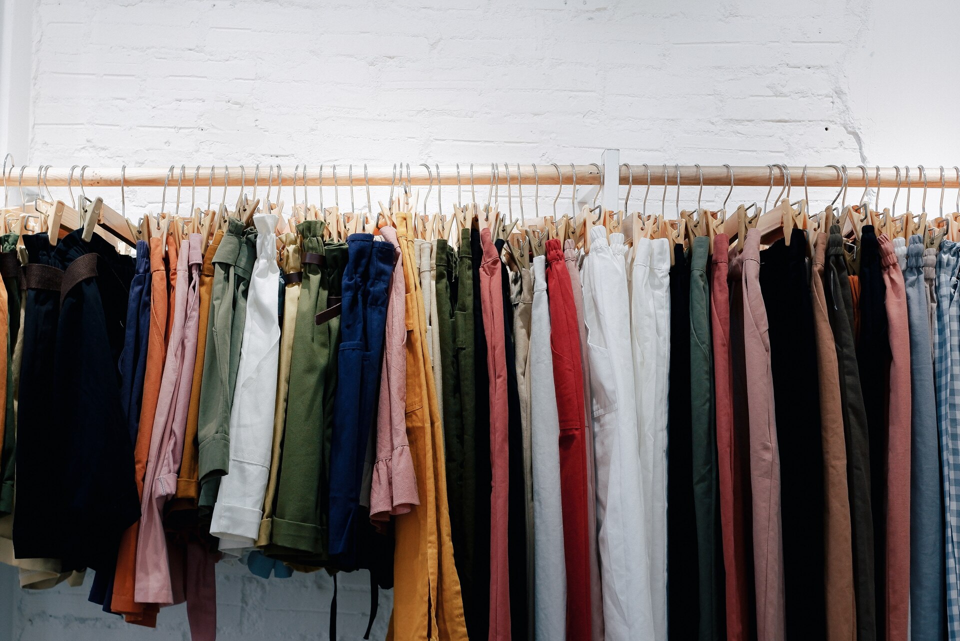 Rack displaying a variety of clothes, neatly hung and organized for easy access.